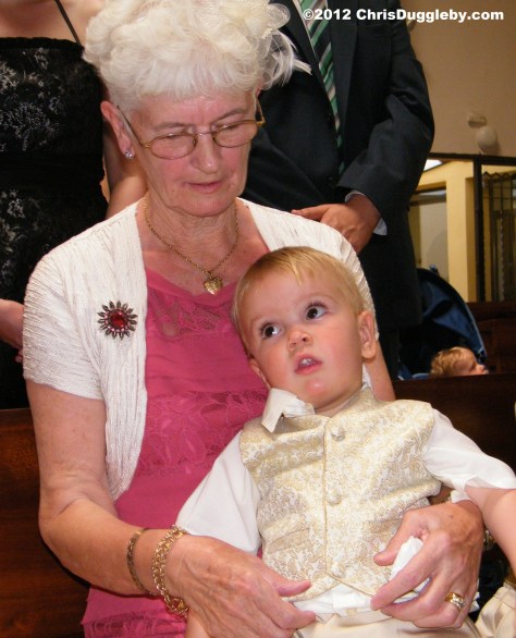 During the ceremony Adam looks on with his Grandma