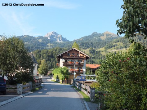 Road leading into Bayrischzell with the Wendelstain mountain in the background Road leading into Bayrischzell with the Wendelstain mountain in the background