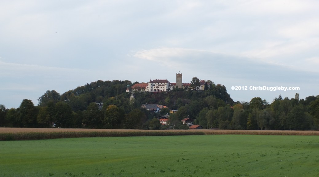 View across the fields of the fairytale castle of Schloss Neubeuern in the Bavarian Alps