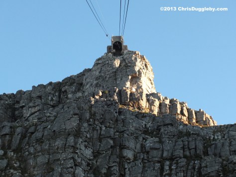 Will they get this big cable car into that little hole at the top of Table Mountain
