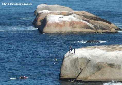 1 Four Cape Town Girls in Wetsuits jumping off Sunset Rocks