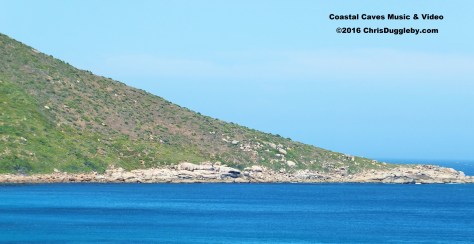 Closer view of the entrance to the Karbunkel Caverns (dark spot in middle of the costline) taken from my Llandudno balcony